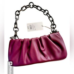 A New Day rich burgundy purse with short pewter strap chain. NWT